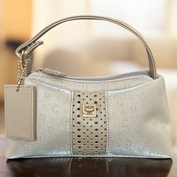 MCM Handbags - MCM Mini Top Handle Bag
Champagne Monogram Leather